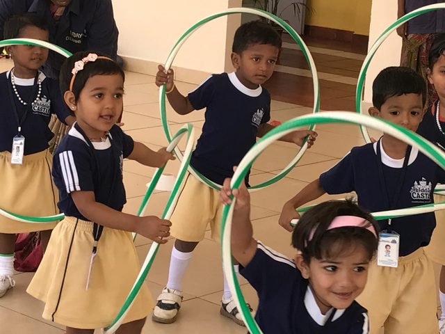 Children learning through play with hoops